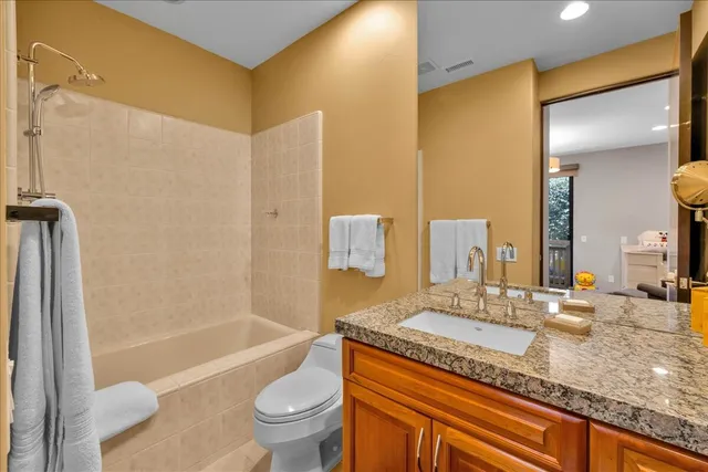 a view of a patio with a table and chairs