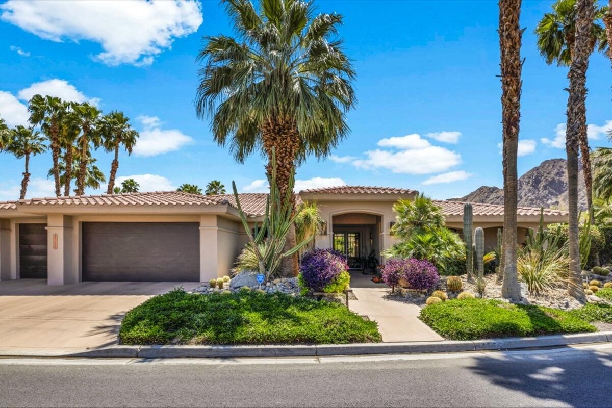 45730 Indian Canyon Road Indian Wells, CA 92210 - Photo 4 of 71 front view of a house with a garden