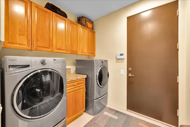 a bed room with a bed and a large window