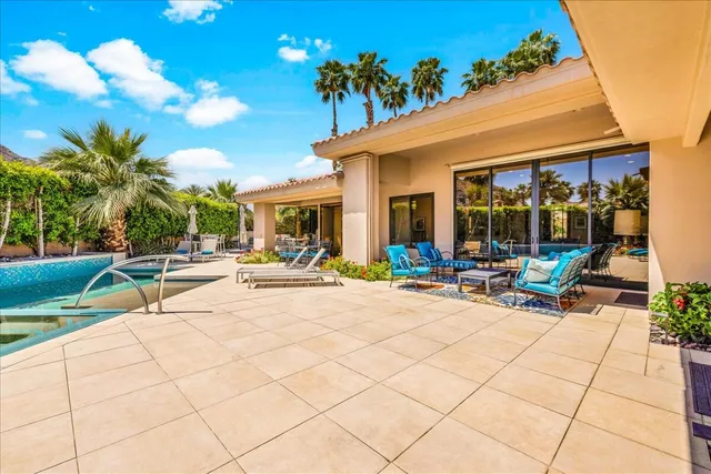 a view of a swimming pool with a patio