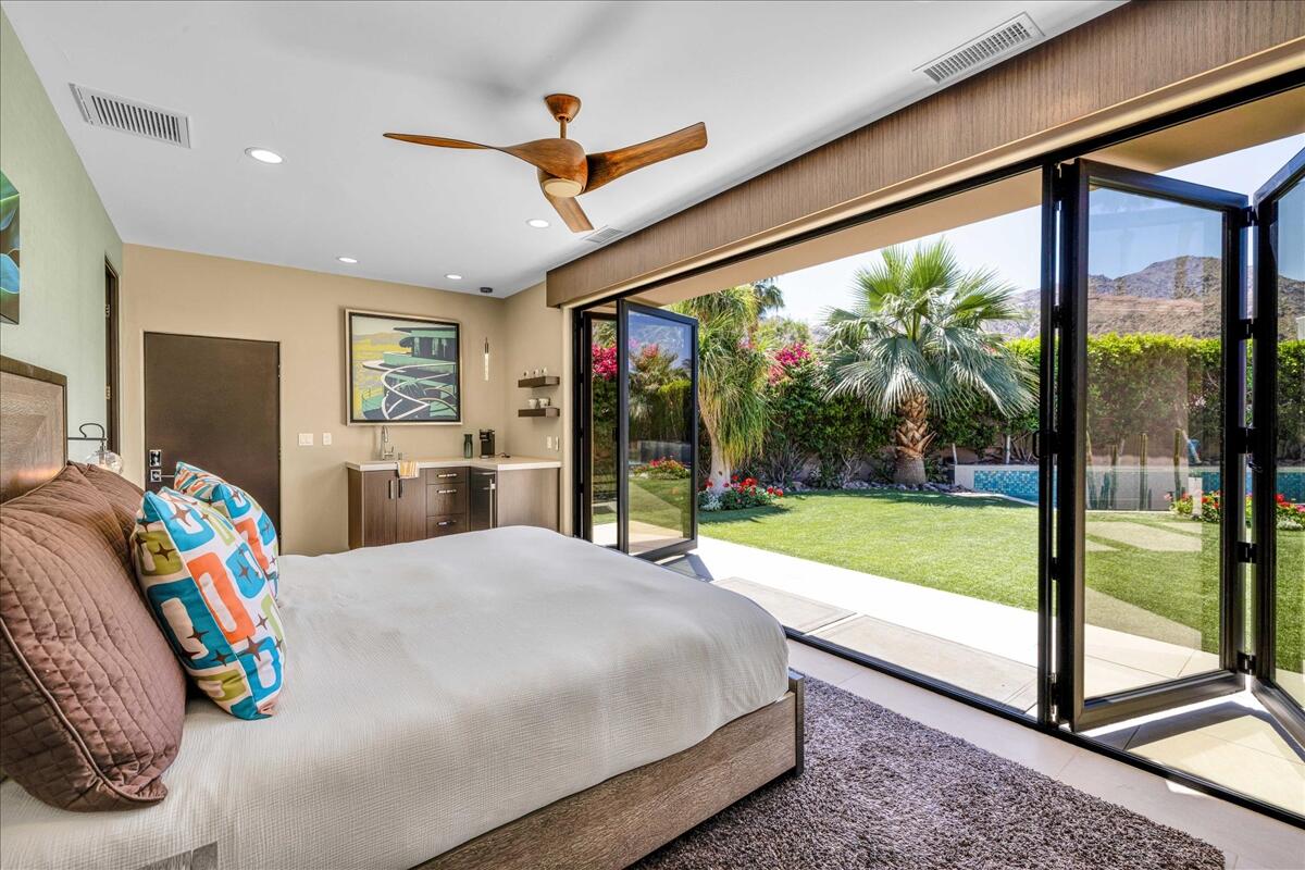 45730 Indian Canyon Road Indian Wells, CA 92210 - Photo 57 of 71 a bed room with a bed and a large window
