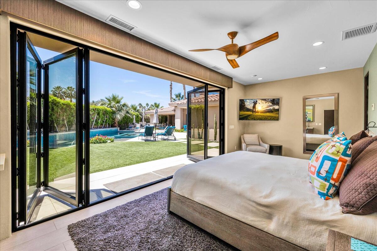 45730 Indian Canyon Road Indian Wells, CA 92210 - Photo 58 of 71 a bedroom with a bed and a view of living room