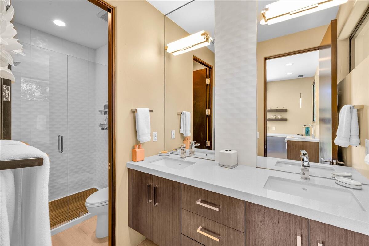 45730 Indian Canyon Road Indian Wells, CA 92210 - Photo 60 of 71 a bathroom with a double vanity sink mirror and double