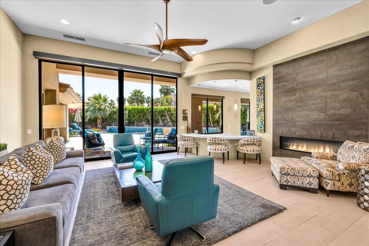 45730 Indian Canyon Road Indian Wells, CA 92210 - Photo 7 of 71 a living room with furniture and a large window