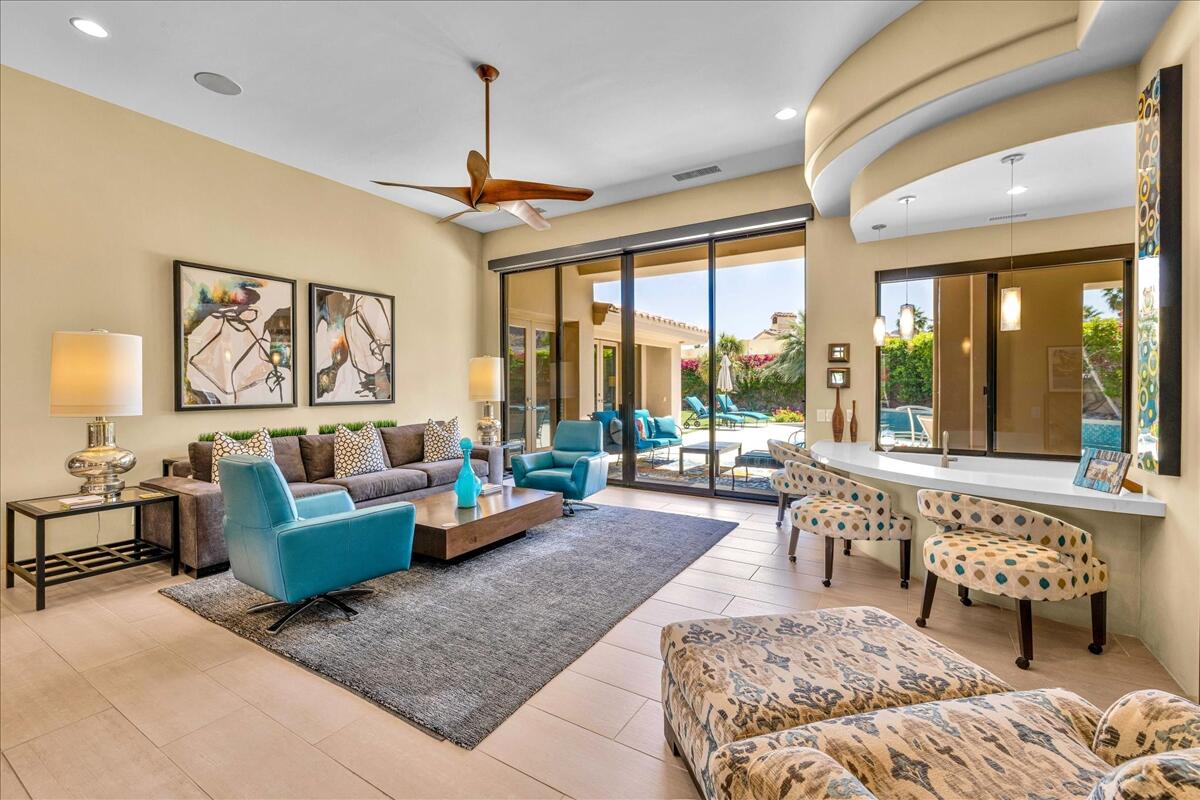 45730 Indian Canyon Road Indian Wells, CA 92210 - Photo 8 of 71 a living room with furniture and a large window