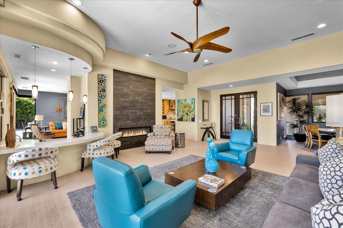 45730 Indian Canyon Road Indian Wells, CA 92210 - Photo 10 of 71 a living room with furniture and a large window