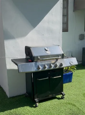 a stove top oven sitting inside of a kitchen