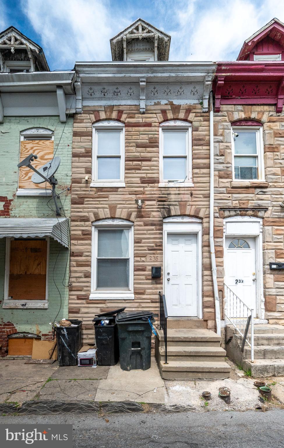 a front view of a house with a garage