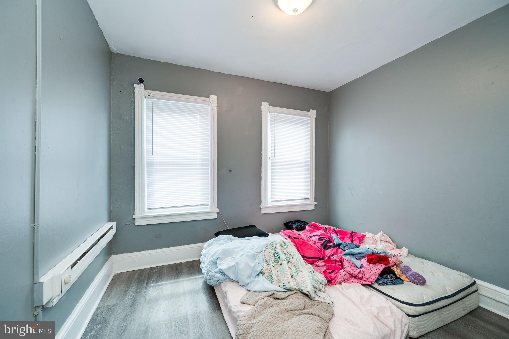 235 Hudson Street Reading, PA 19601 - Photo 11 of 25 a bedroom with a bed and a window