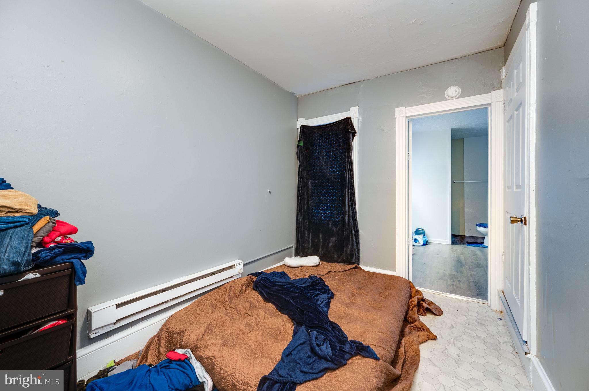 235 Hudson Street Reading, PA 19601 - Photo 14 of 25 a bed sitting in a bedroom next to a window