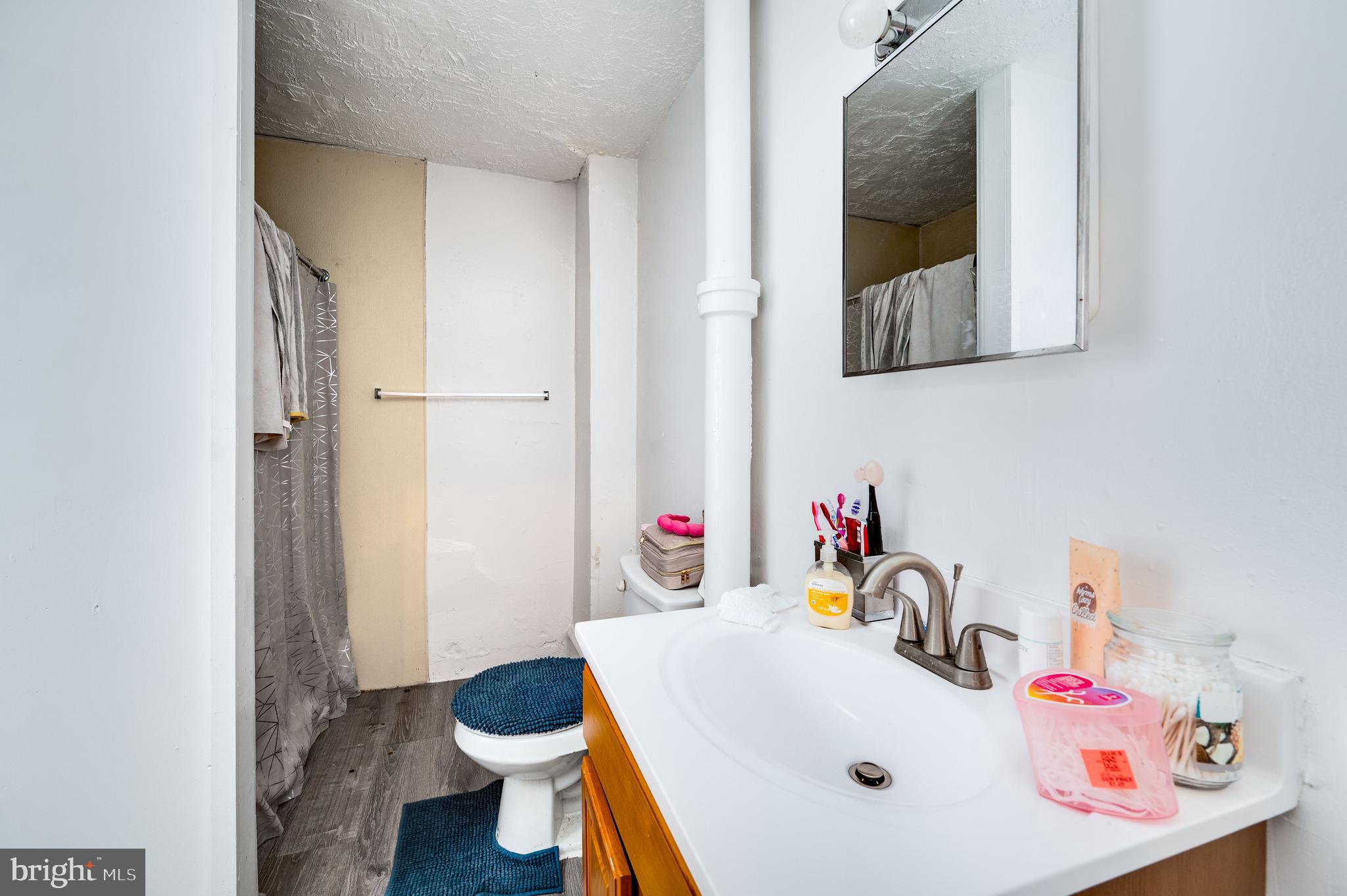 235 Hudson Street Reading, PA 19601 - Photo 18 of 25 a bathroom with a sink and a toilet