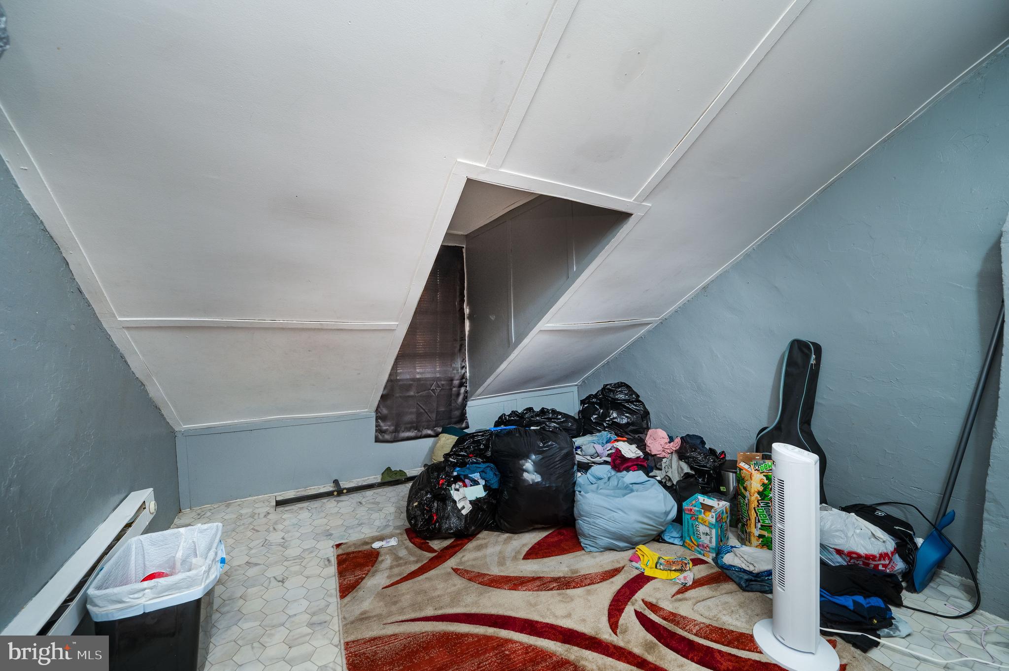 235 Hudson Street Reading, PA 19601 - Photo 19 of 25 a room with furniture and a wooden floor