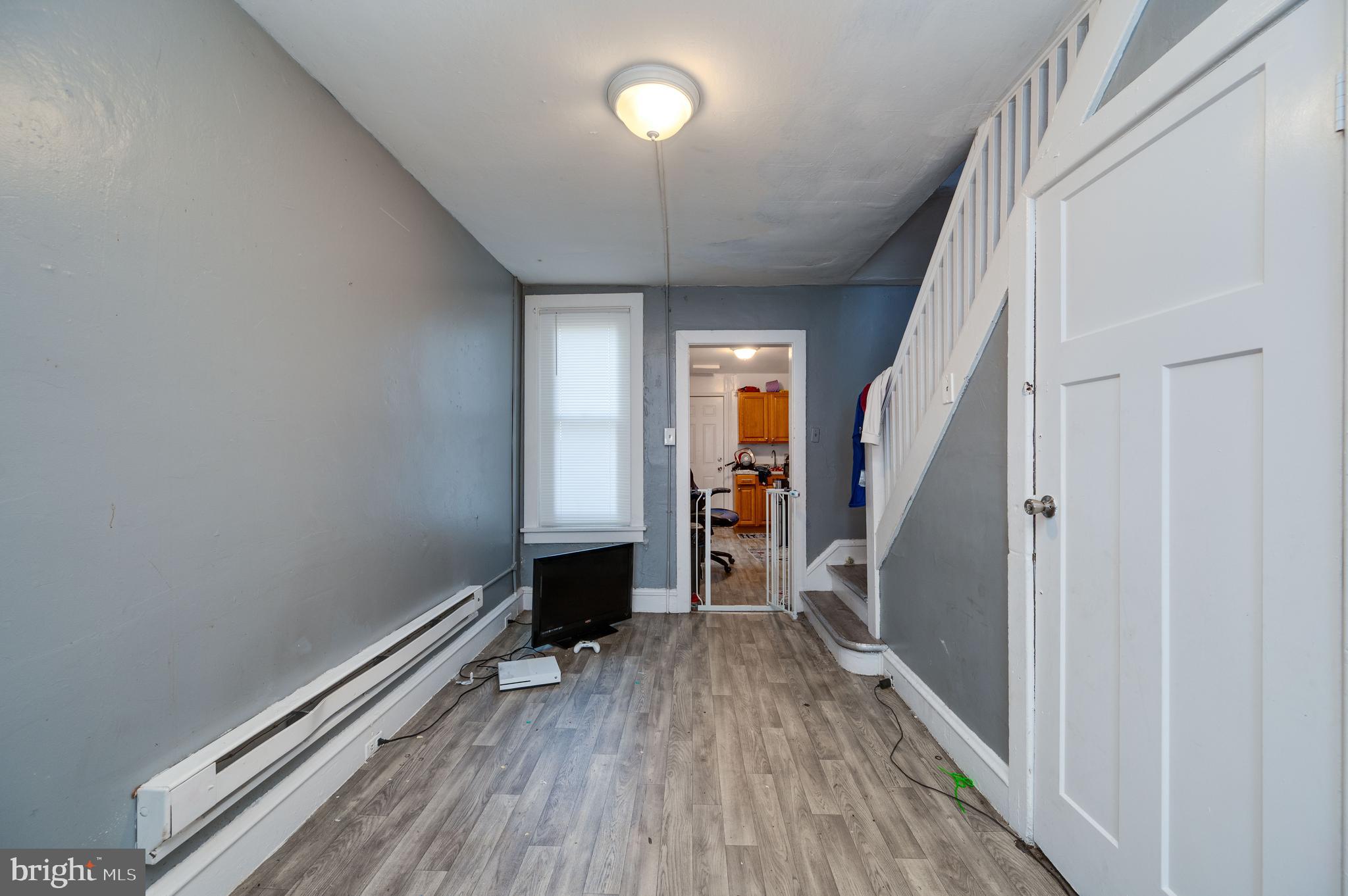 235 Hudson Street Reading, PA 19601 - Photo 4 of 25 a view of hallway with wooden floor and stairs