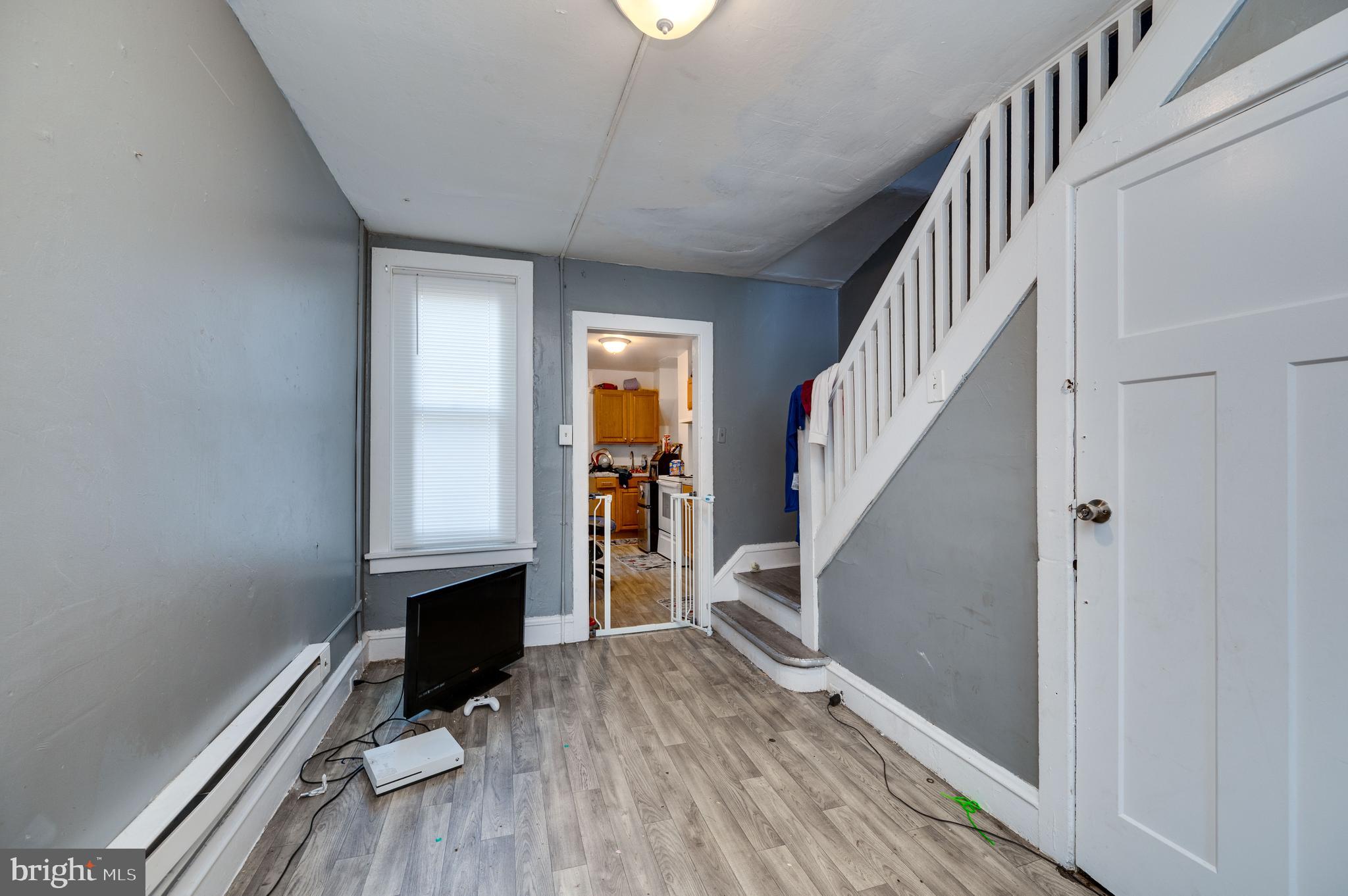 235 Hudson Street Reading, PA 19601 - Photo 5 of 25 a view of entryway with wooden floor and stairs