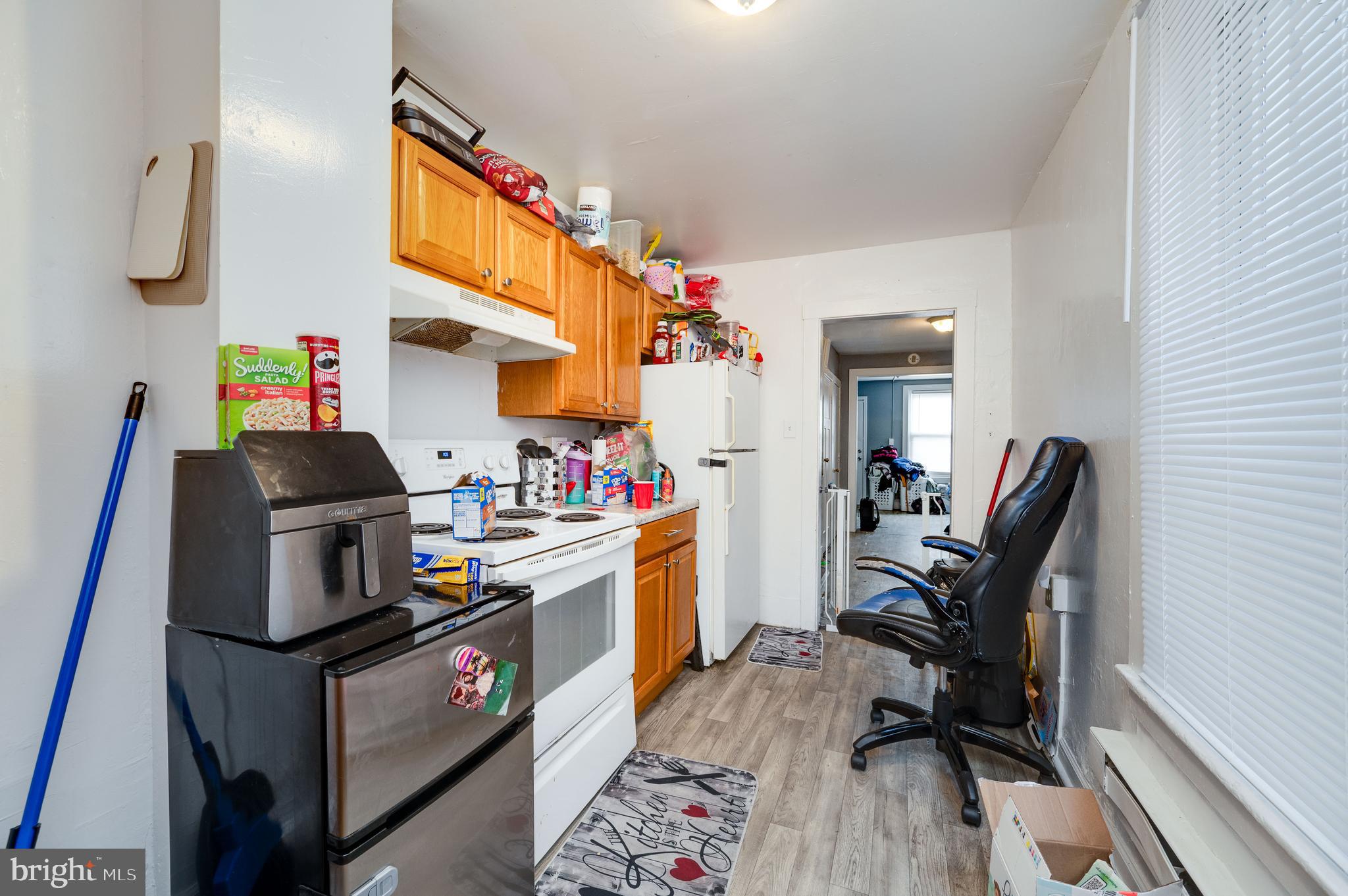 235 Hudson Street Reading, PA 19601 - Photo 9 of 25 a view of kitchen and dining room with wooden furniture