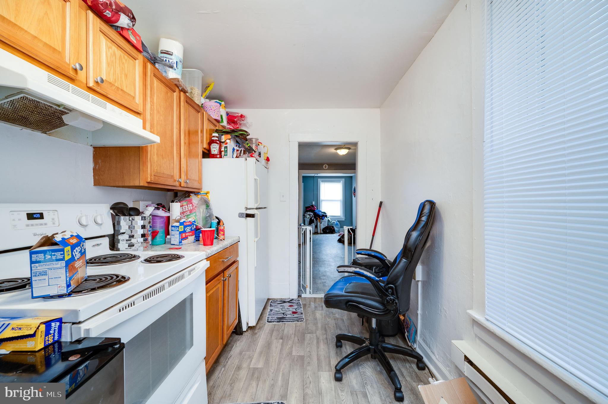 235 Hudson Street Reading, PA 19601 - Photo 10 of 25 a view of a kitchen with fridge and workspace