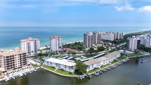 a view of a house with a yard and lake view
