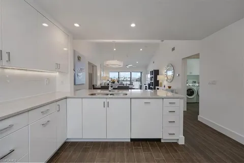 a dining room with furniture a rug and wooden floor