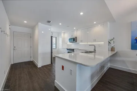 a kitchen with a stove and a microwave