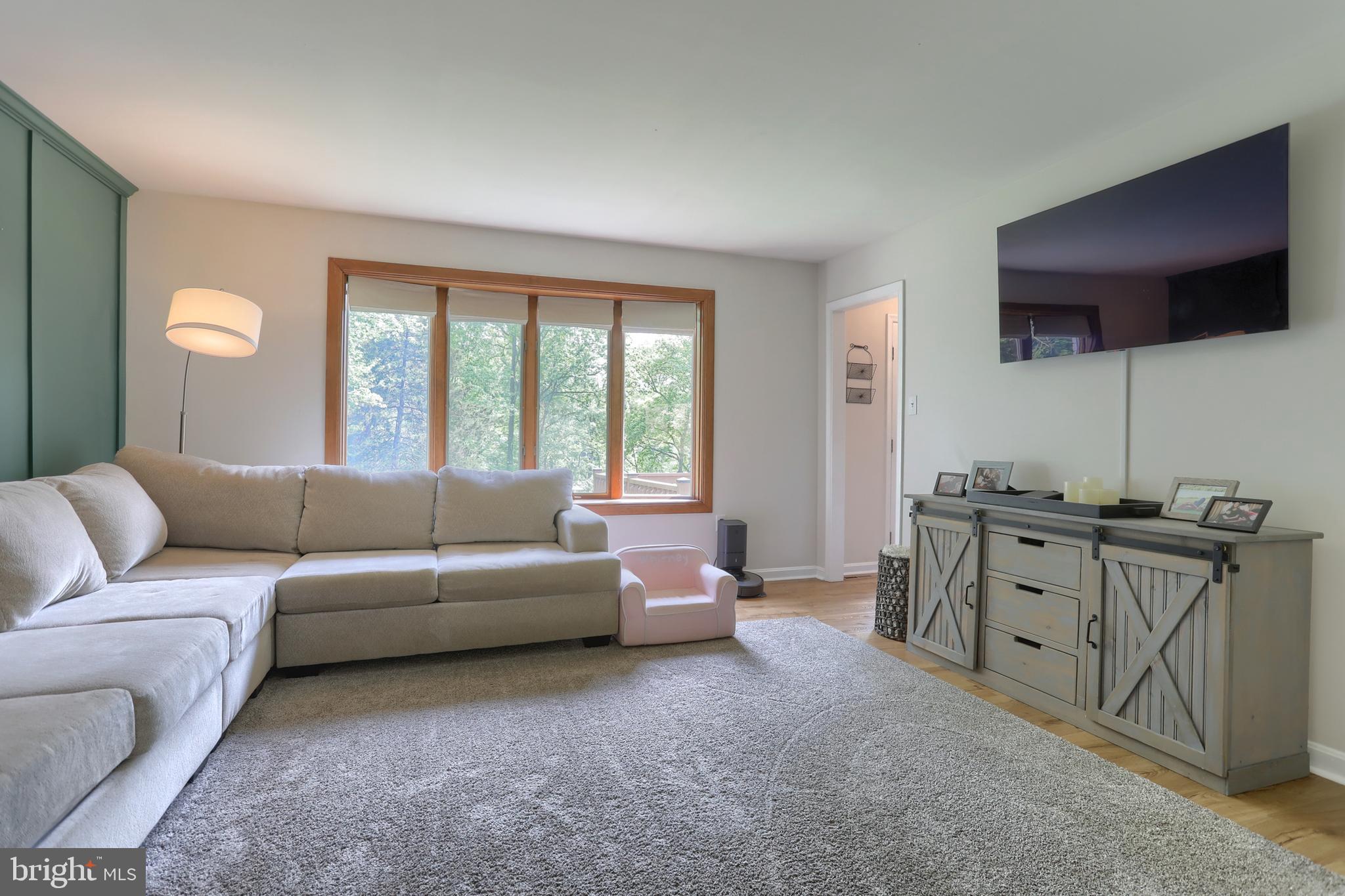 46 Gelsinger Road Reading, PA 19608 - Photo 18 of 50 a living room with furniture a flat screen tv and a window
