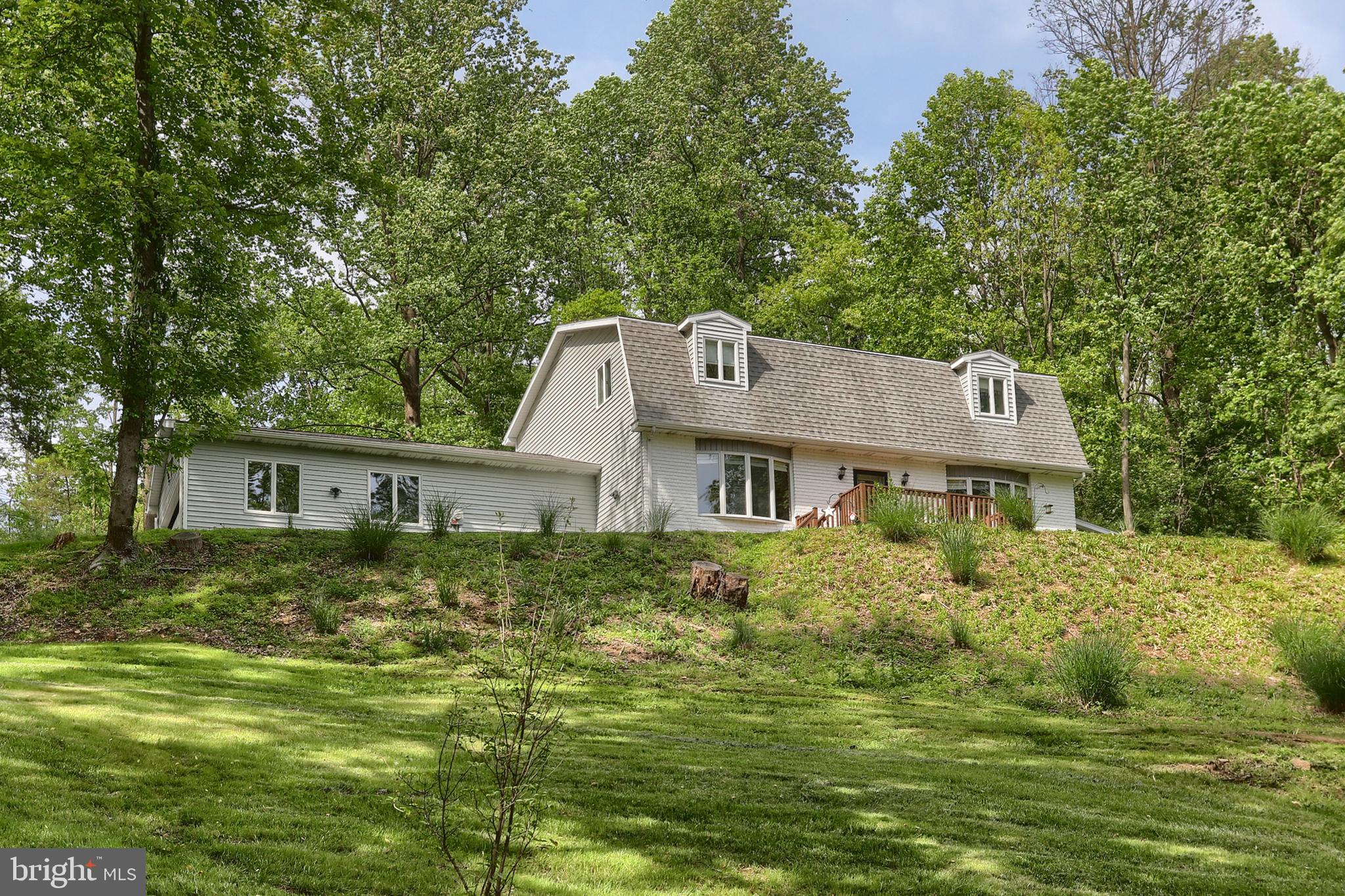 46 Gelsinger Road Reading, PA 19608 - Photo 2 of 50 a front view of a house with a garden