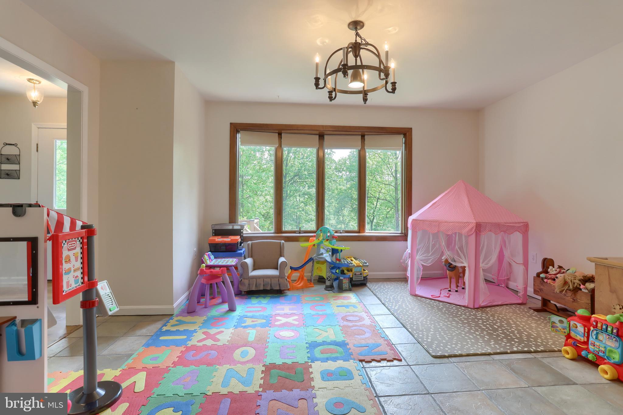 46 Gelsinger Road Reading, PA 19608 - Photo 21 of 50 a bedroom with a bed and a chandelier