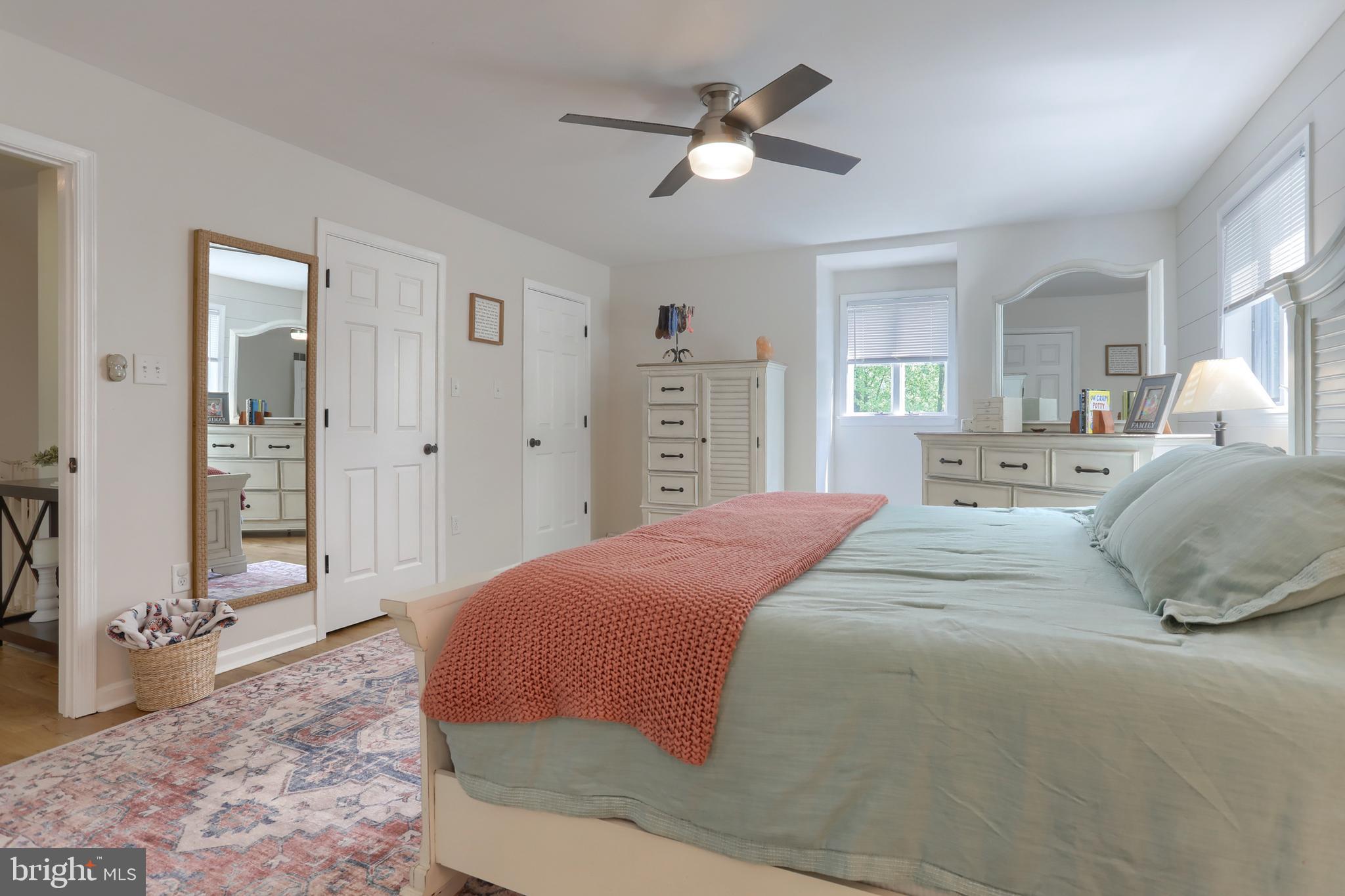 46 Gelsinger Road Reading, PA 19608 - Photo 27 of 50 a bedroom with a large bed and a chandelier