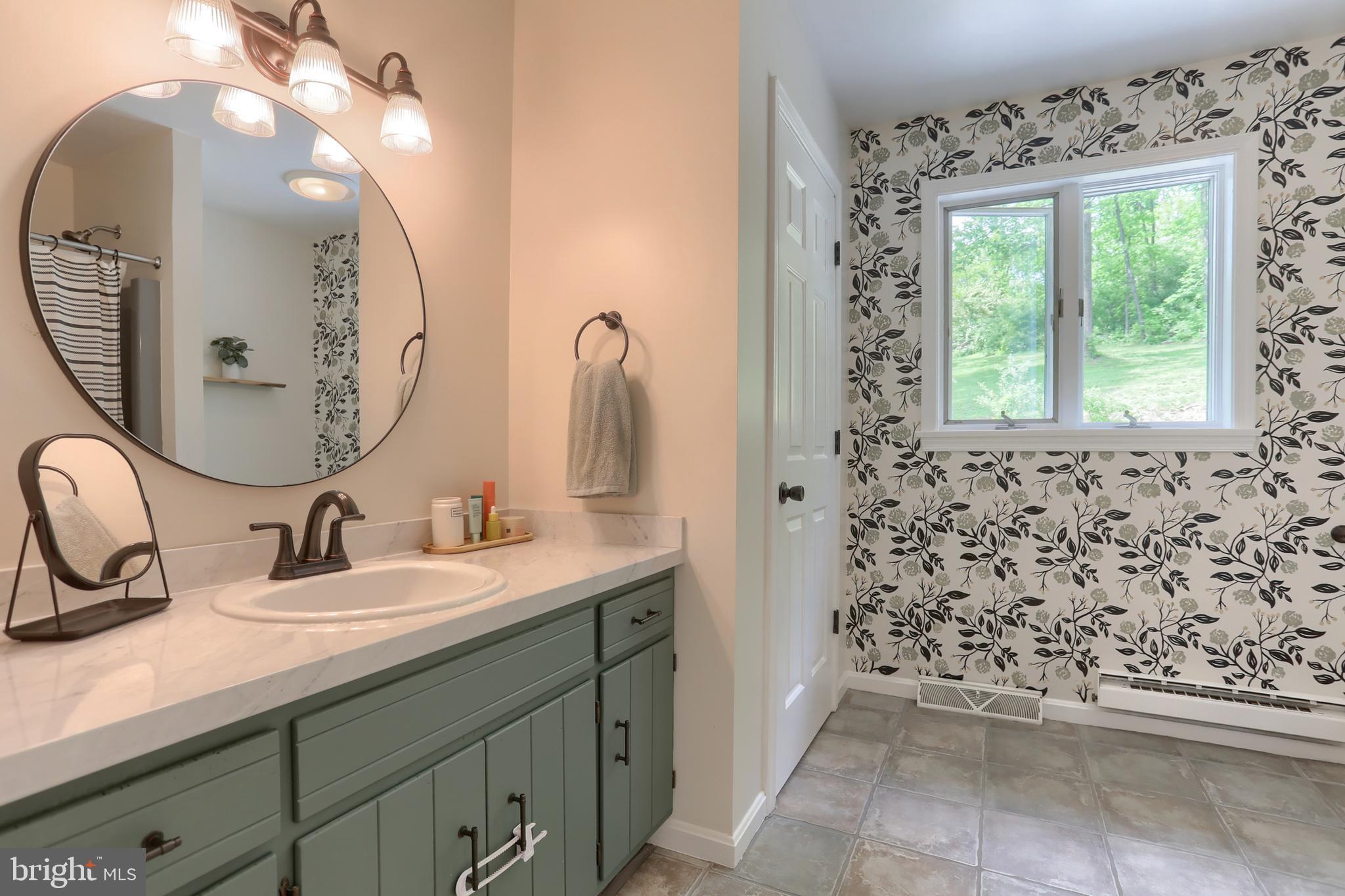 46 Gelsinger Road Reading, PA 19608 - Photo 29 of 50 a bathroom with a double vanity sink mirror and shower