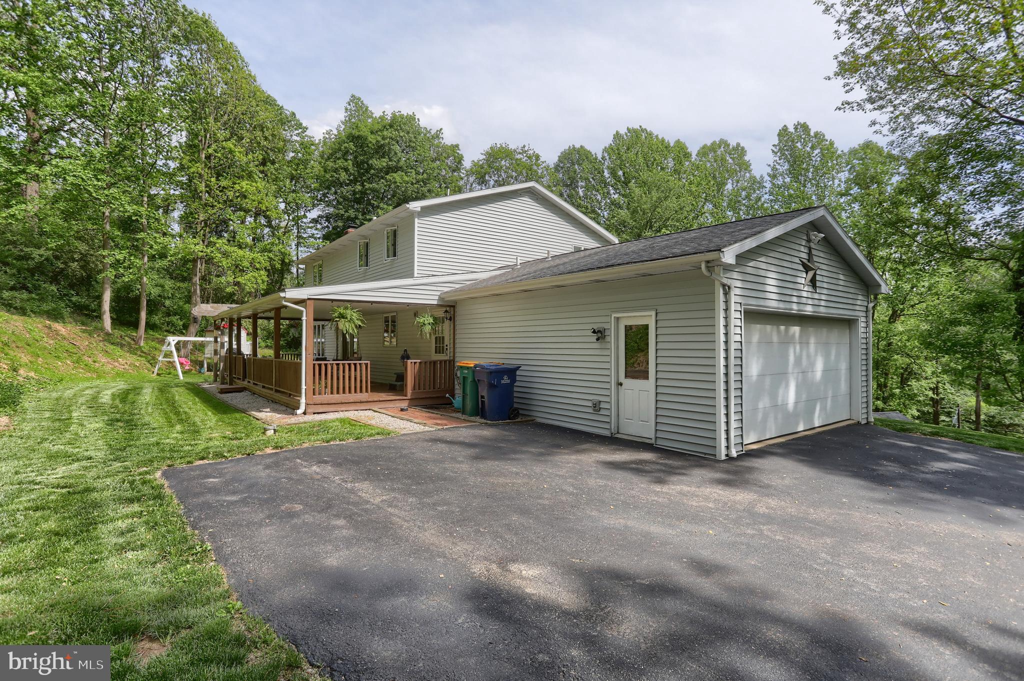 46 Gelsinger Road Reading, PA 19608 - Photo 4 of 50 a view of a house with a yard and large trees