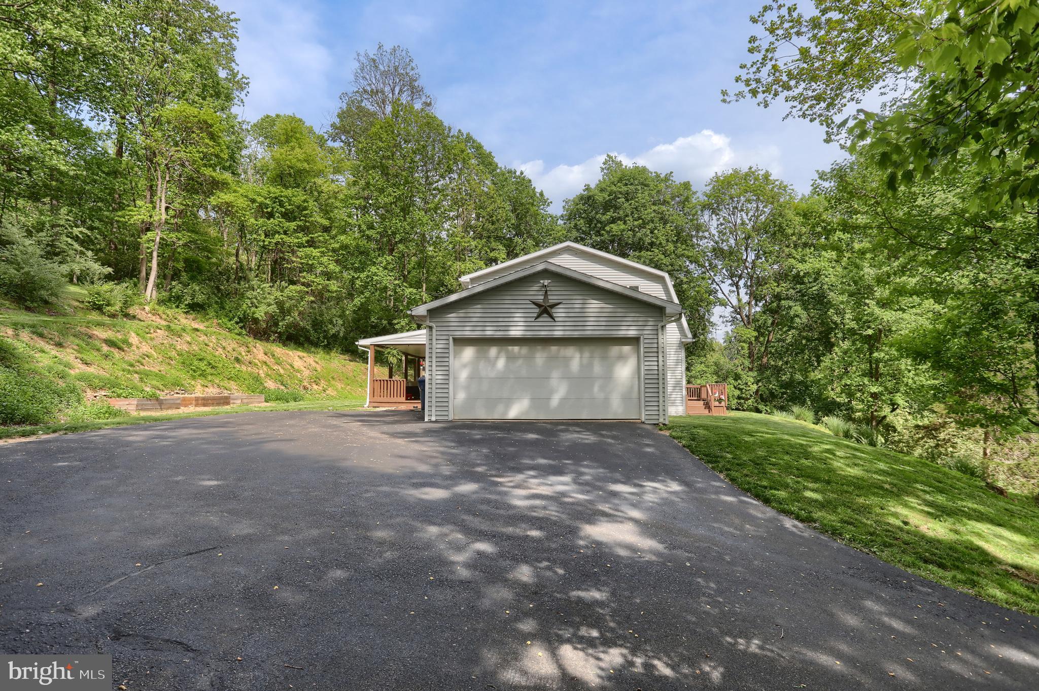 46 Gelsinger Road Reading, PA 19608 - Photo 45 of 50 a front view of a house with a yard and garage
