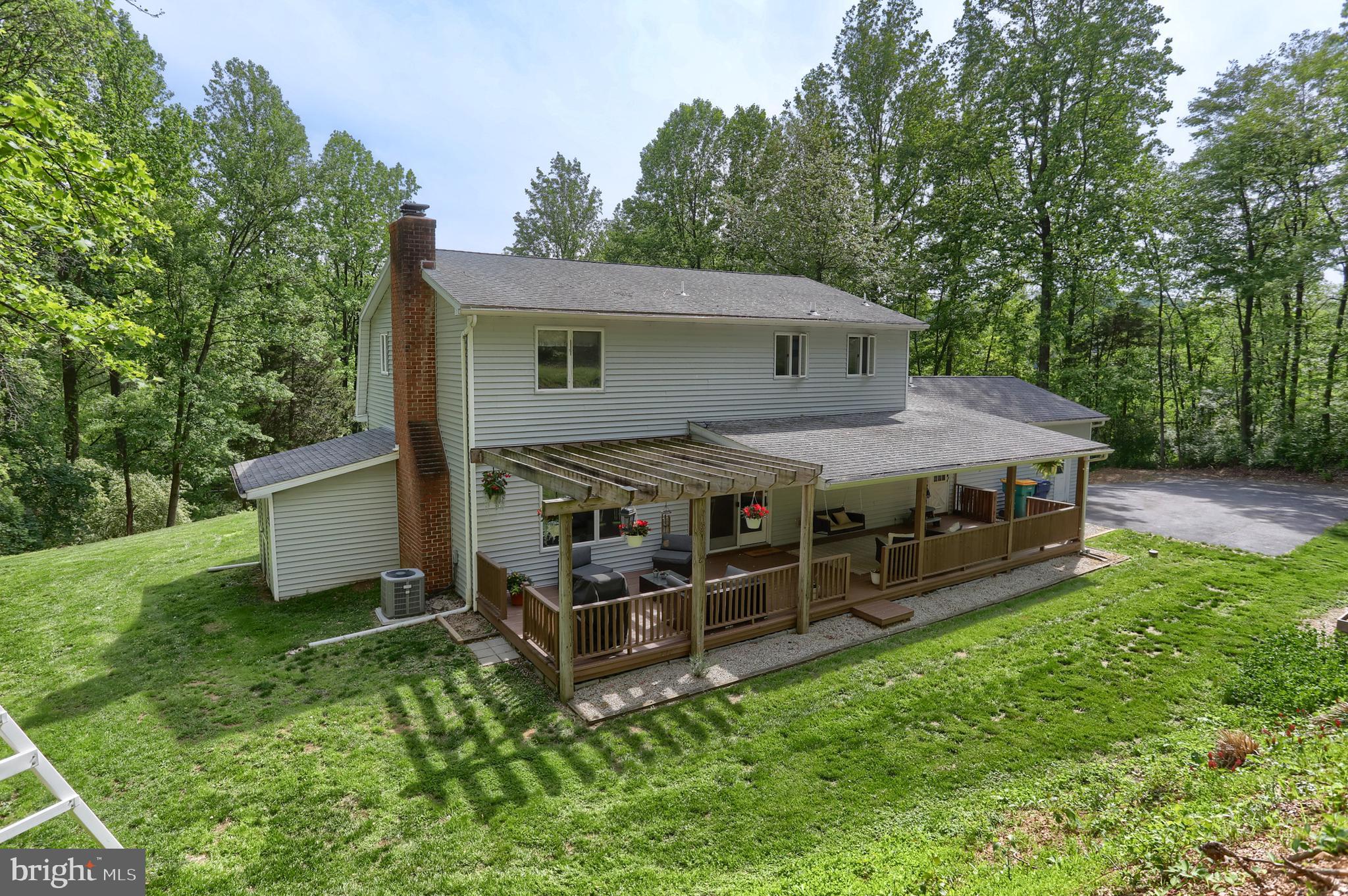 46 Gelsinger Road Reading, PA 19608 - Photo 5 of 50 a view of a house with wooden deck and a yard