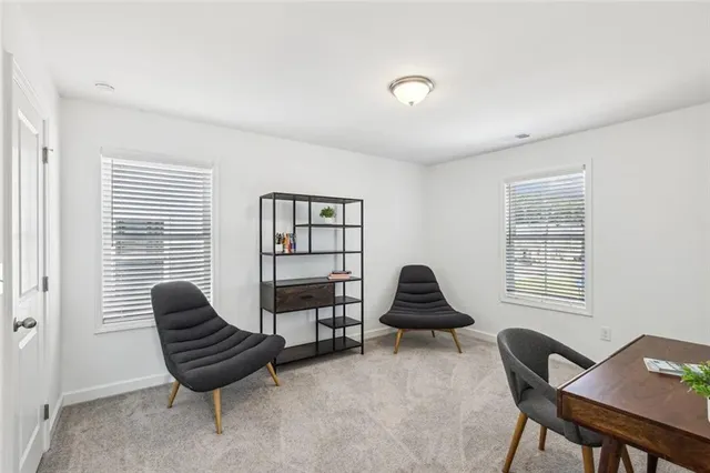 a bedroom with a bed and chair