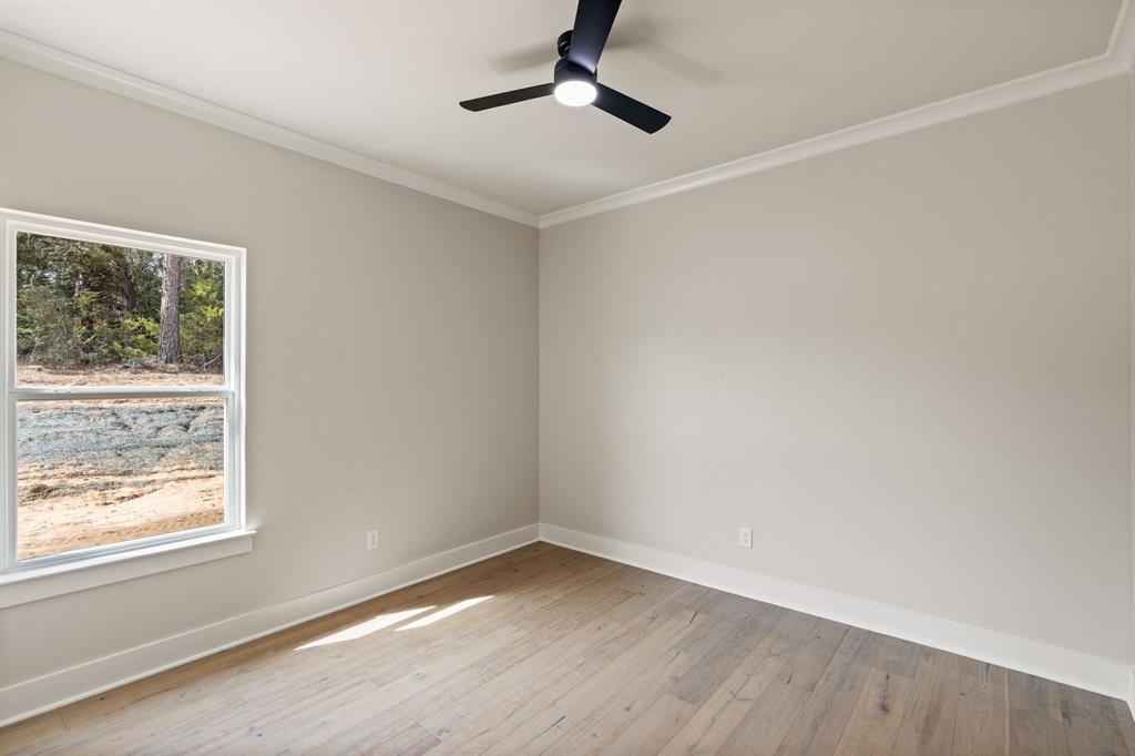 335 Perdanales Bullard, TX 75757 - Photo 9 of 37 wooden floor in an empty room with a window