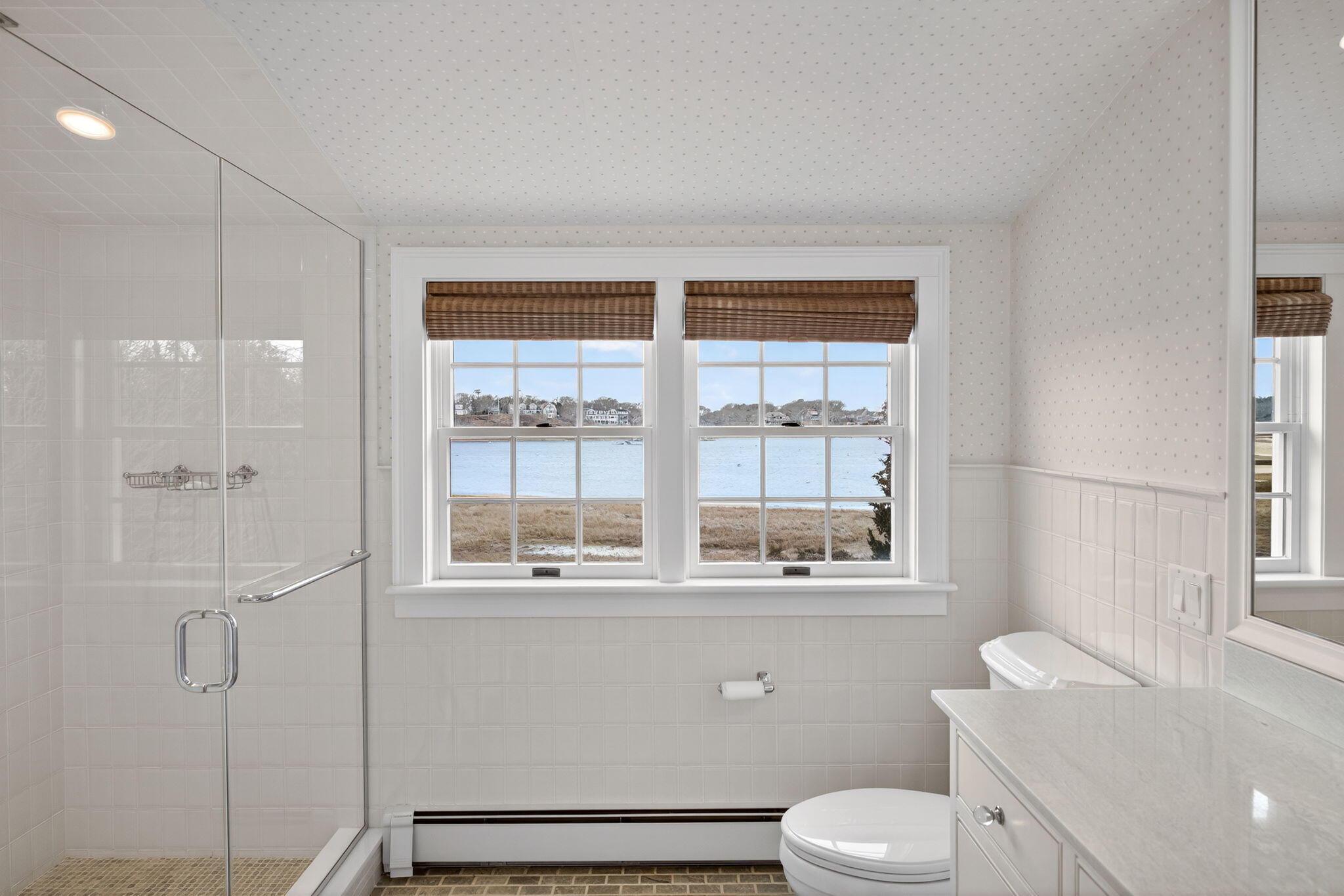 346 Morris Island Road Chatham, MA 02633 - Photo 25 of 33 a bathroom with a toilet sink vanity and shower