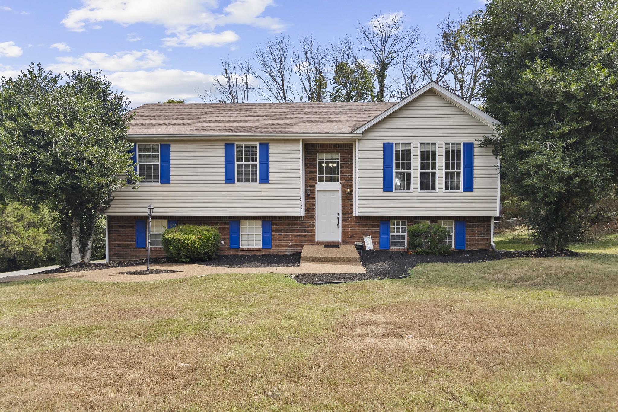 210 Winding Way Columbia, TN 38401 - Photo 2 of 28 a front view of a house with a yard