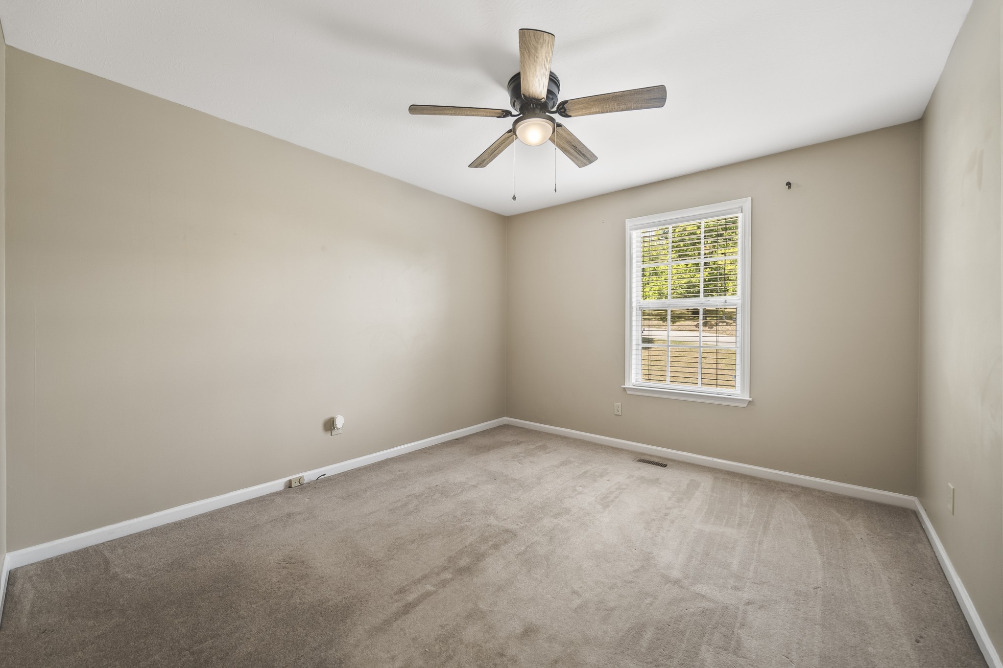 210 Winding Way Columbia, TN 38401 - Photo 8 of 28 an empty room with a window and a fan