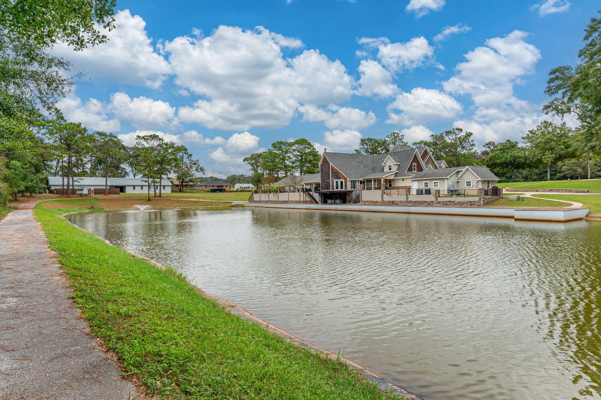 2767 Phil Tyner Road Crestview, FL 32536 - Photo 146 of 176 a view of a lake with houses in the back