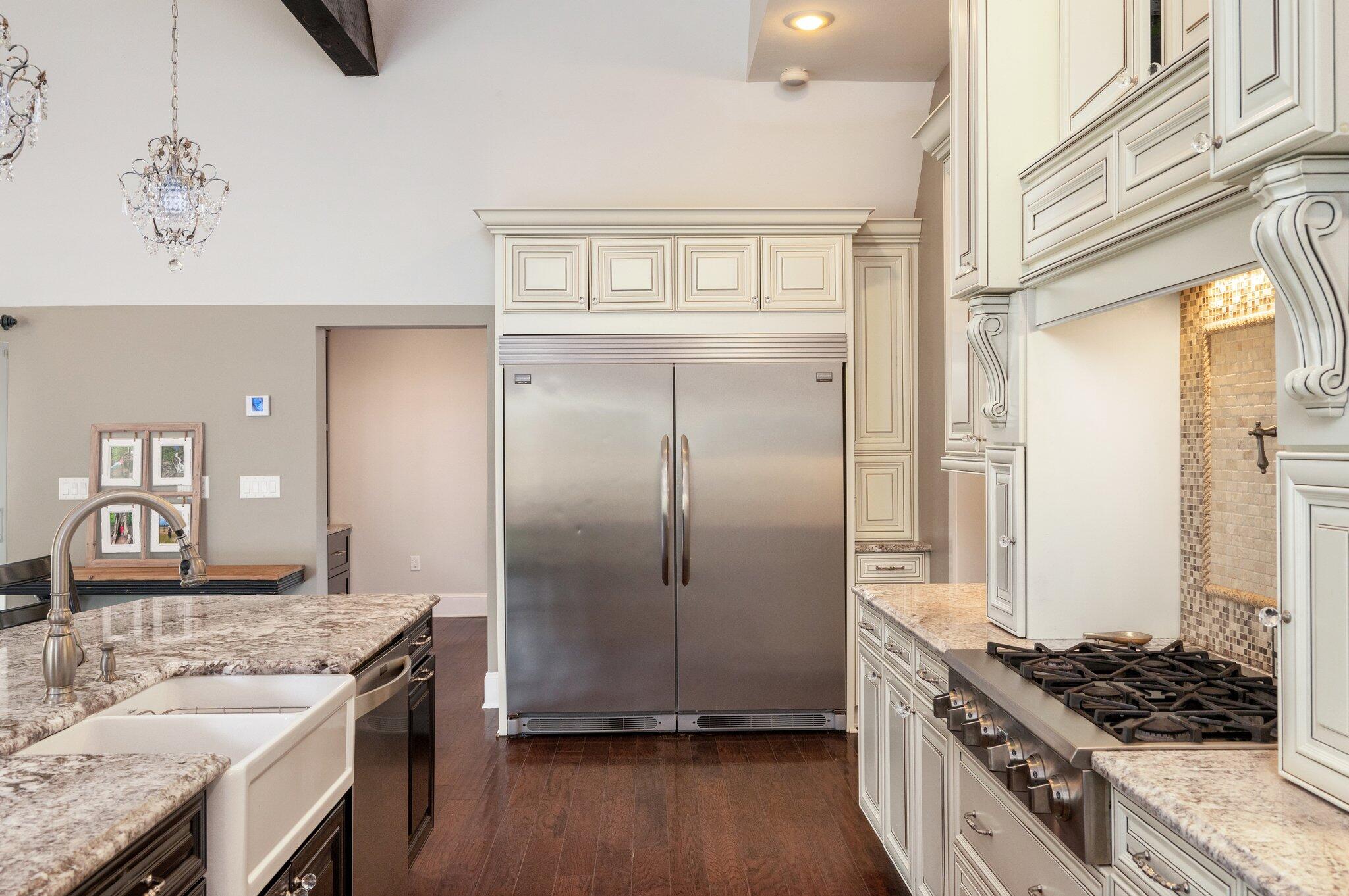 2767 Phil Tyner Road Crestview, FL 32536 - Photo 24 of 176 a kitchen with stainless steel appliances granite countertop a stove and a refrigerator