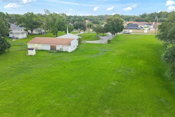 a view of a house with a big yard