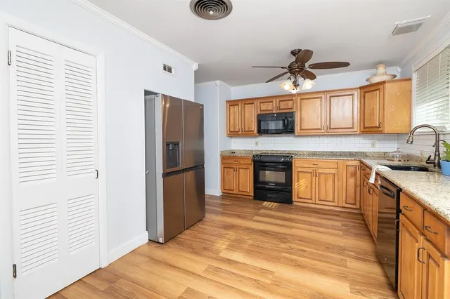 a kitchen with a refrigerator and a microwave