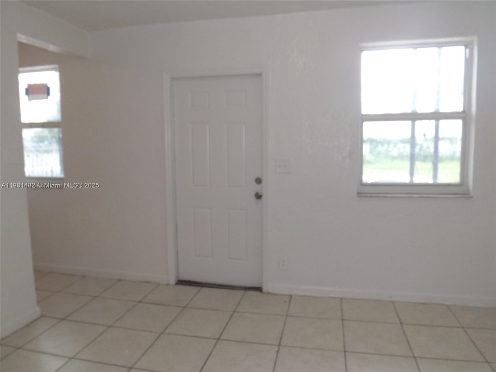 160 Northwest 11th Terrace, Unit 2 Miami, FL 33136 - Photo 7 of 9 an empty room with windows