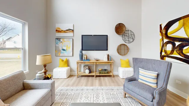 a living room with furniture and a mirror