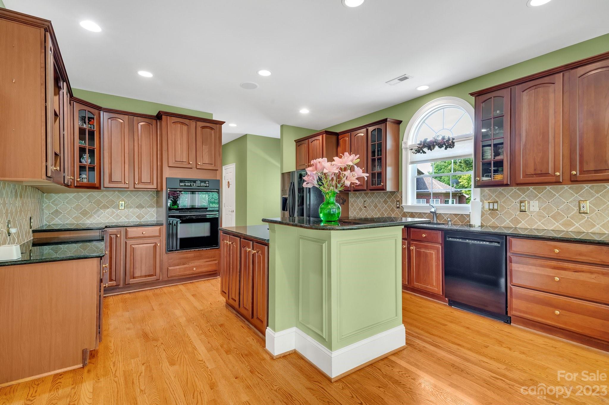 256 Hemingway Lane Fort Mill, SC 29708 - Photo 14 of 41 a kitchen with stainless steel appliances granite countertop a refrigerator a stove top oven and a sink