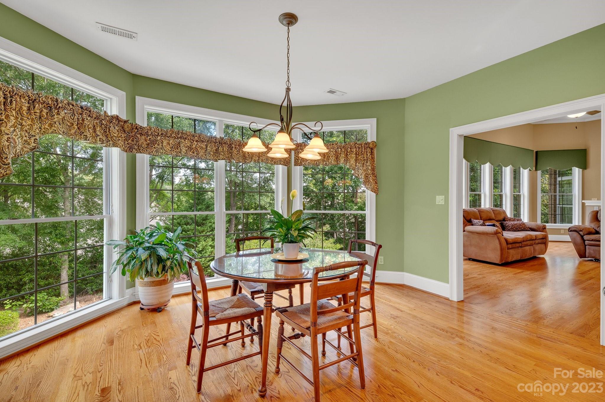 256 Hemingway Lane Fort Mill, SC 29708 - Photo 15 of 41 a dining room with furniture water view and a floor to ceiling window
