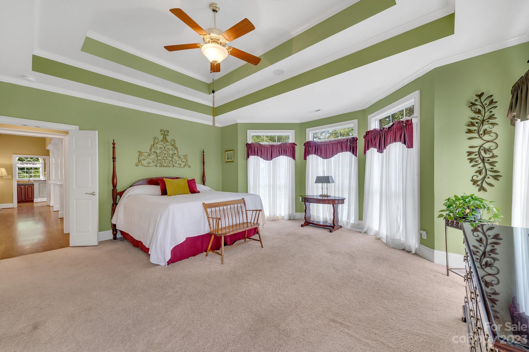 256 Hemingway Lane Fort Mill, SC 29708 - Photo 21 of 41 a bedroom with a bed and a chandelier