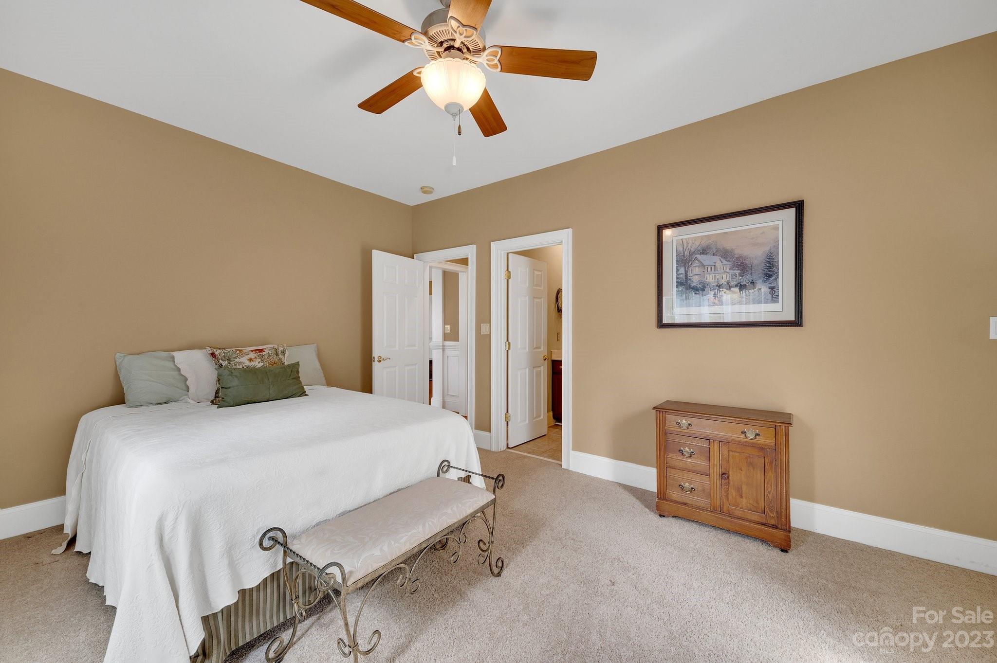 256 Hemingway Lane Fort Mill, SC 29708 - Photo 25 of 41 a bedroom with a bed and a chandelier