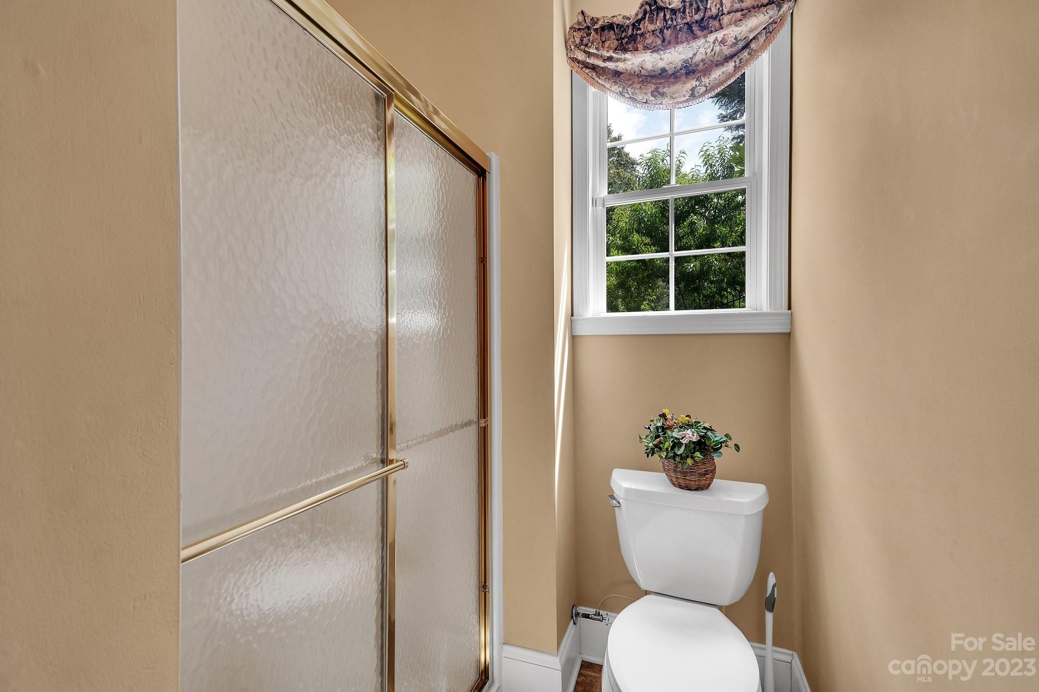256 Hemingway Lane Fort Mill, SC 29708 - Photo 31 of 41 a white toilet sitting next to a window