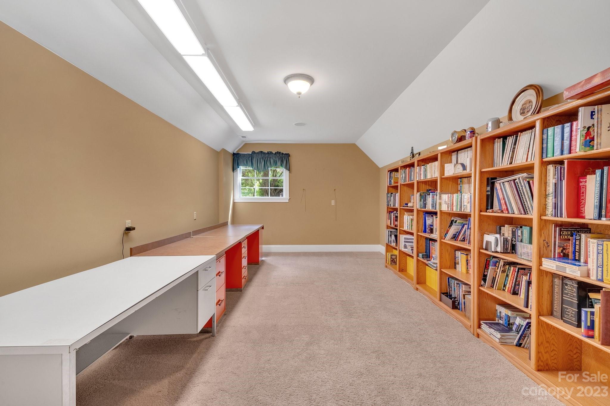 256 Hemingway Lane Fort Mill, SC 29708 - Photo 32 of 41 a room with a book shelf and a book shelf