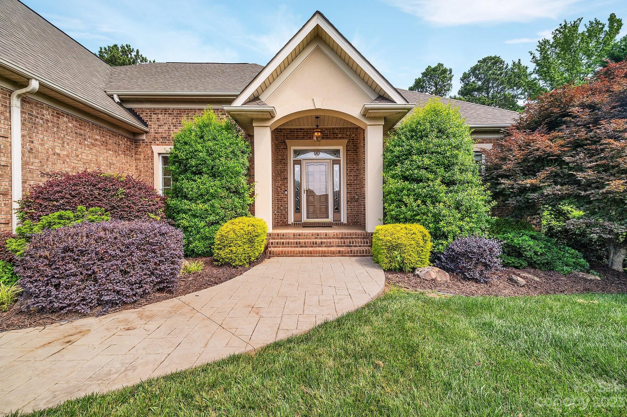 256 Hemingway Lane Fort Mill, SC 29708 - Photo 5 of 41 a front view of a house with garden