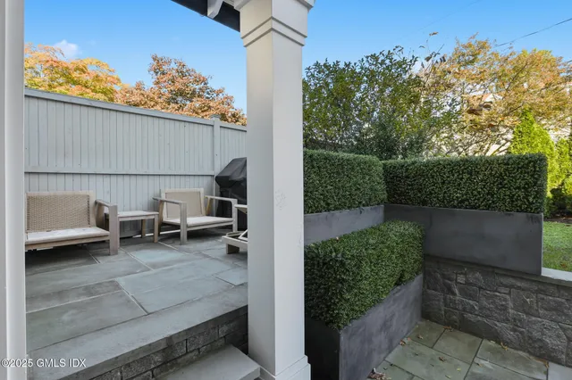 a view of a patio with table and chairs with an outdoor space